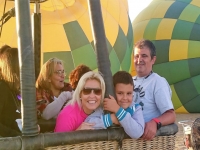  In a balloon with their parents 