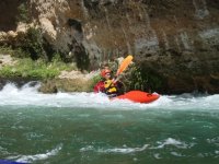  Row in a self-bailing kayak 