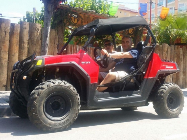  At the wheel of a RZR buggy 