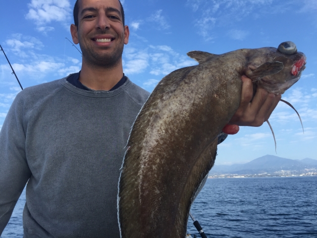 Pescador con su captura