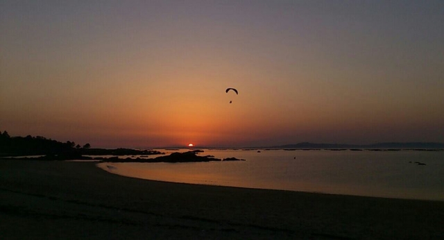  Sonnenuntergangssonne am Strand von Mexilloeira