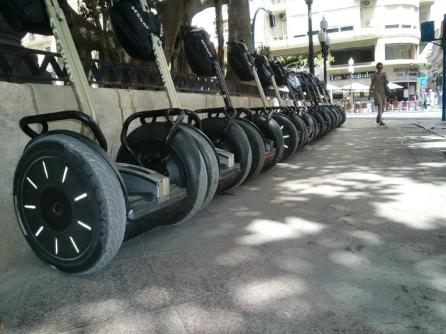  Segways lined up on the sidewalk 