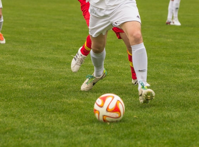  Stepping forward to touch the ball 