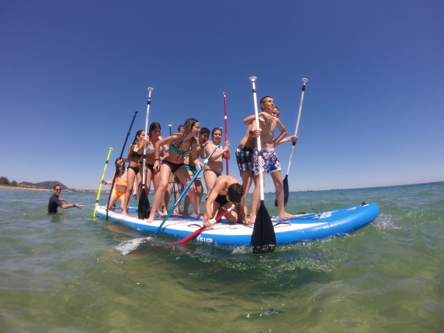  Boys and girls on a big sup board 