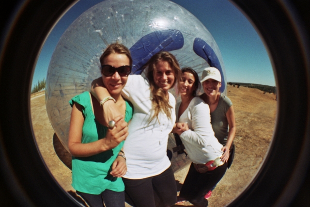 Girls in front of the zorbing ball 
