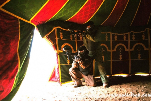  two boys playing paintball behind a store.jpg 