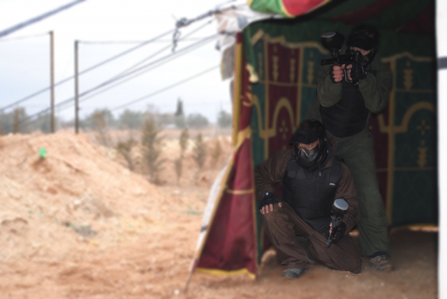  two boys hiding behind a store.jpg 