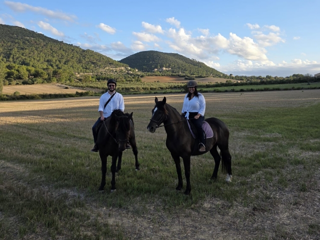  enjoying a ride on white horses 