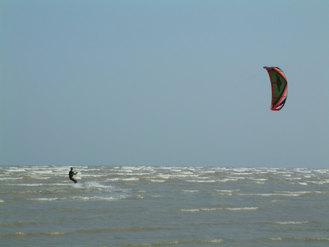 kitesurfing on the water, distant view 