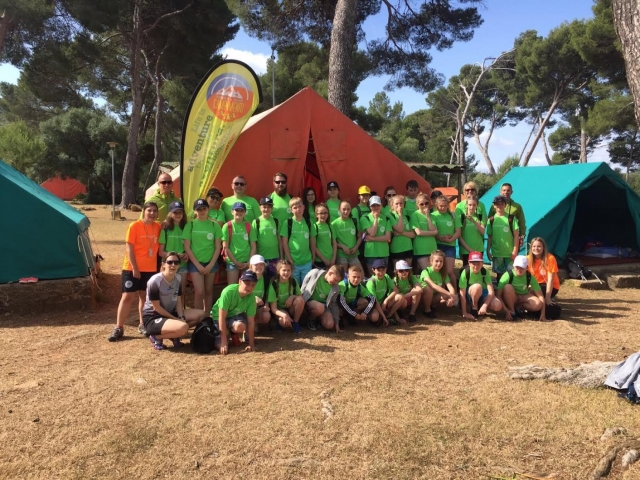  Group of campers next to the tent 
