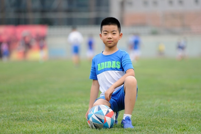  Boy with ball posing 