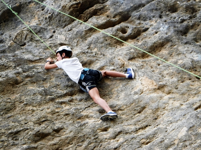  Boy climbing in the mountain 