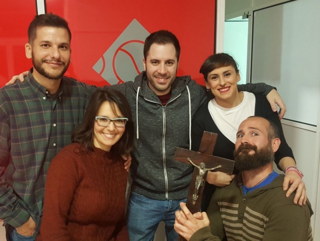  Holding the crucifix in the escape room 