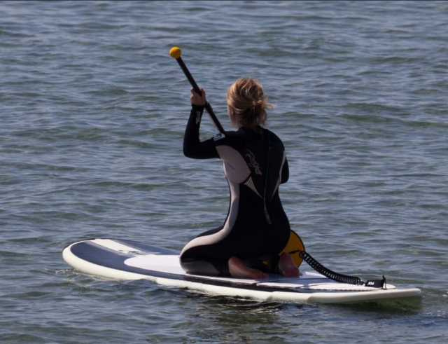  Kneeling on the sup board 
