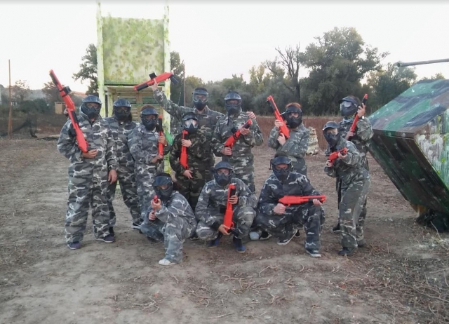  Paintball players with markers red