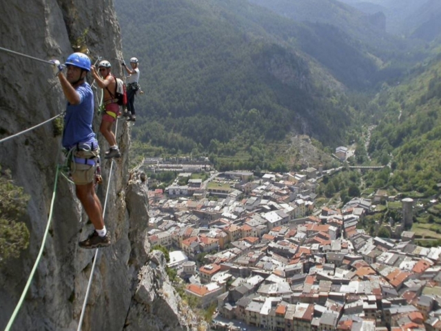Walking along the cable on the ferrata 