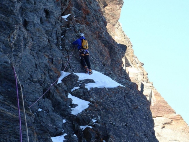  Climber stepping on the snow 