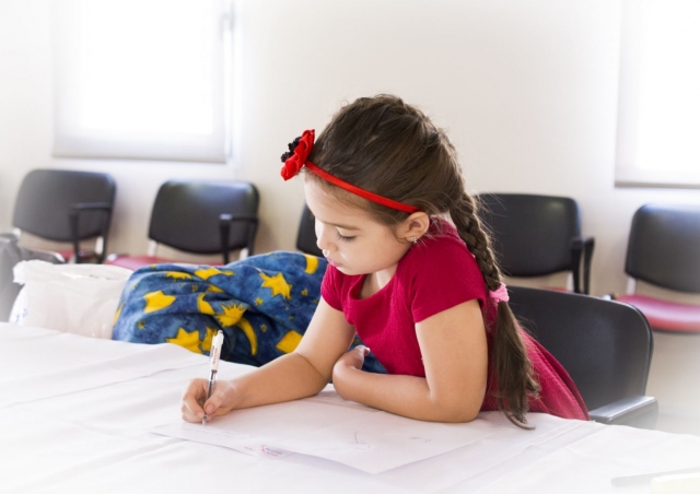  Little boy working in the classroom