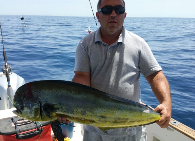 Pescador con dorado