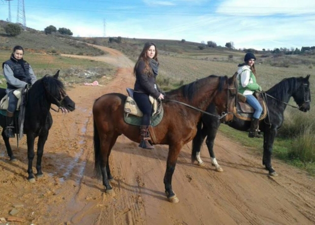  Three girls on horseback riding 