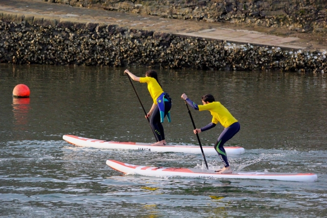  Two students during the paddle surf session 