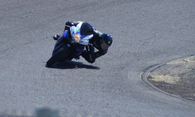  Professional motorcyclist taking a curve 