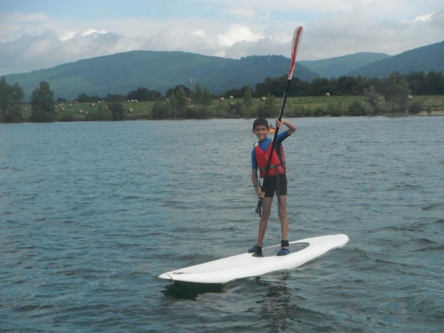  Child on the paddle surf board 