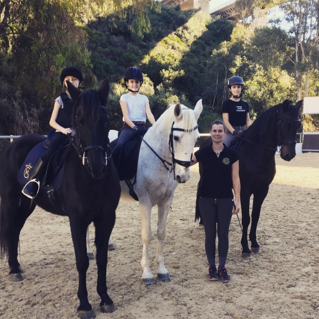  Girls on horses with the teacher 