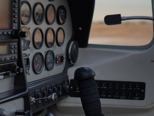  In front of the controls 