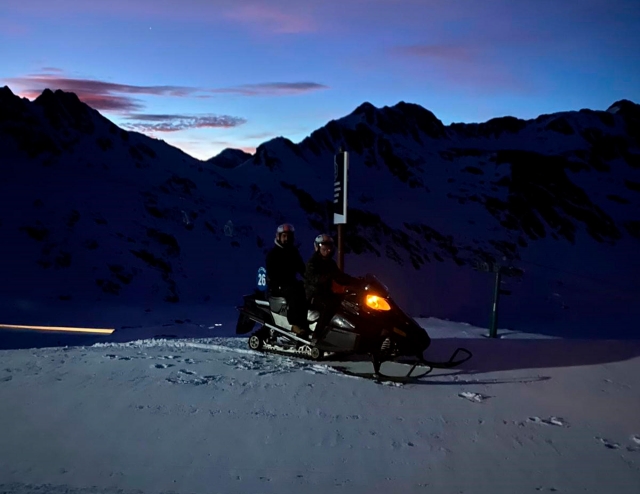  Snowmobiles at sunset 