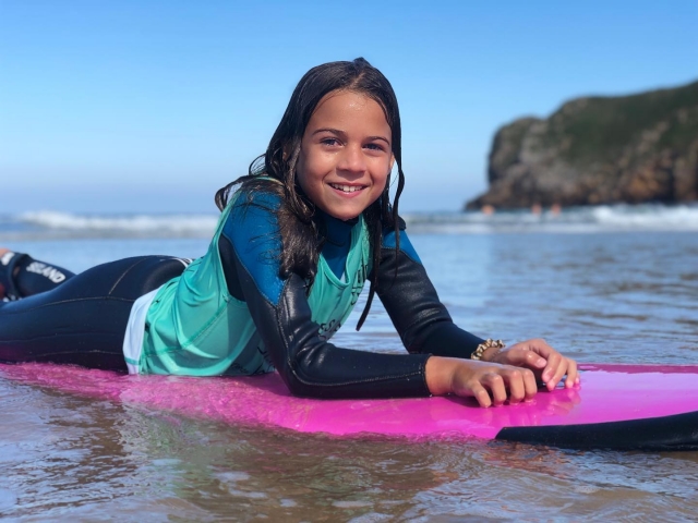 Girl learning to surf 