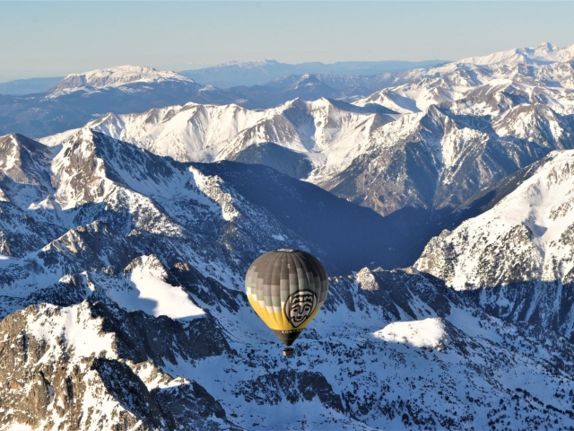  Balloon ride over snowy mountains 