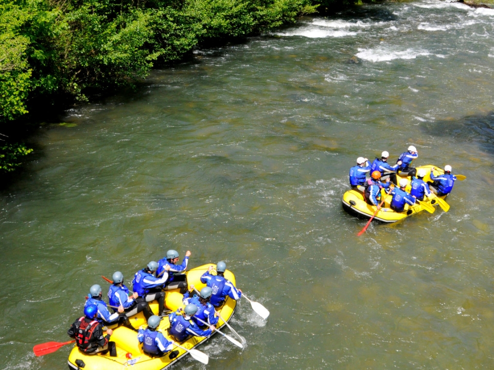 Two groups doing rafting Two groups doing rafting