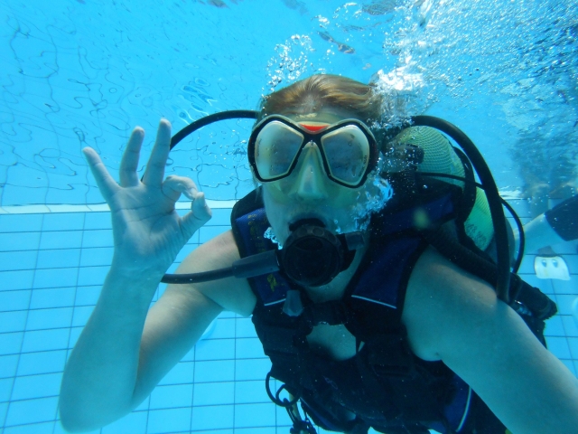  With the diving team in the pool 