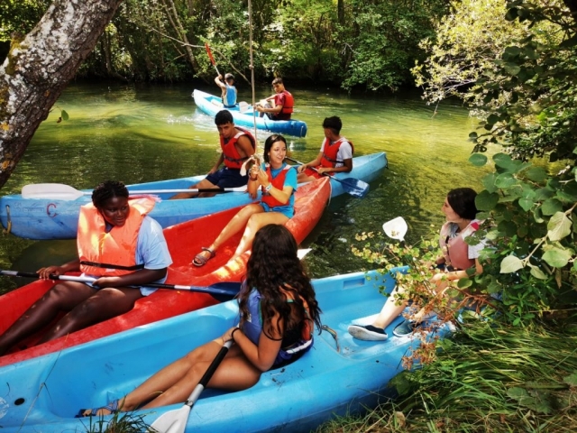  With the canoes on the river 