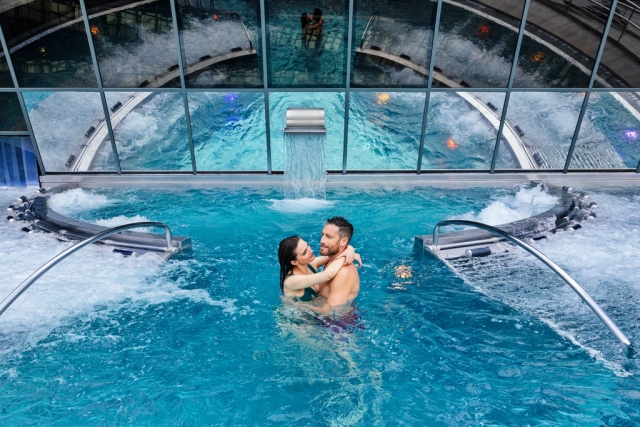  A couple in love enjoys an outdoor pool 
