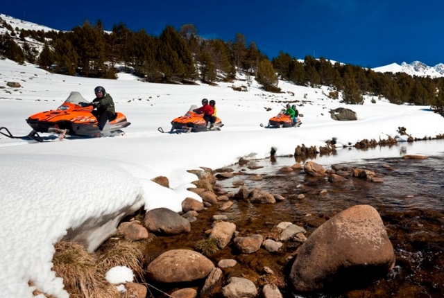  enjoying snowmobiling in grandvalira 