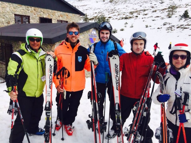  With ski equipment 