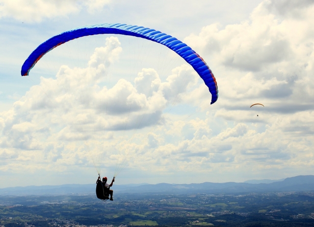  Paragliding with clouds in the background
