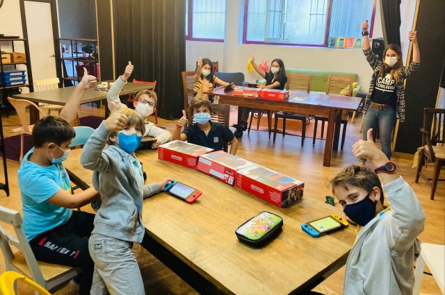  Gathered in a class with several game devices