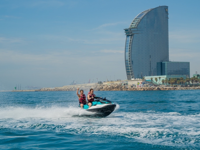  Friends having fun sailing through Barcelona 