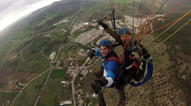  Waving to the camera from the paraglider 