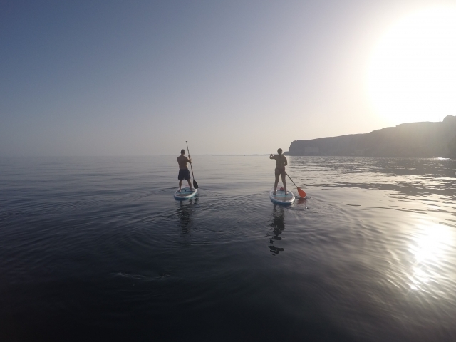  Paddling in the sea with the paddle board 