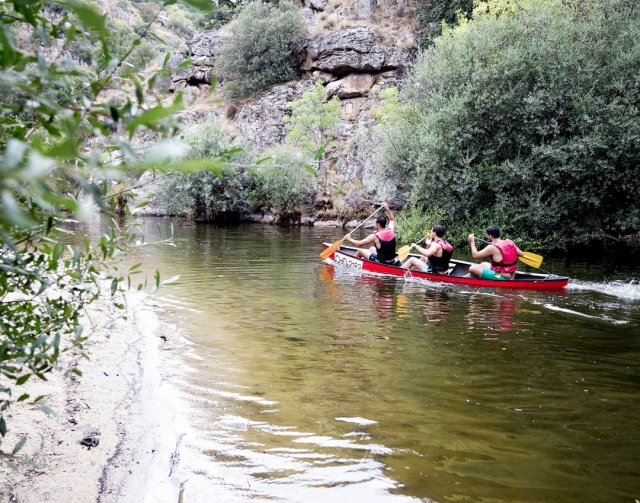  canoes along the riverbank