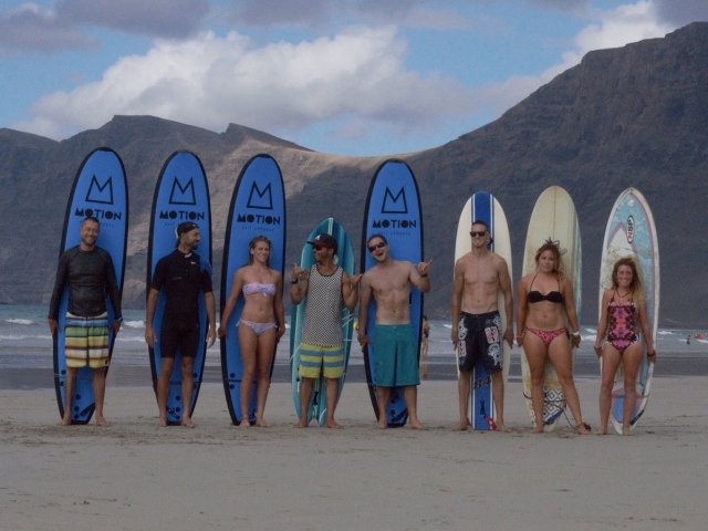 Students with surfboards 