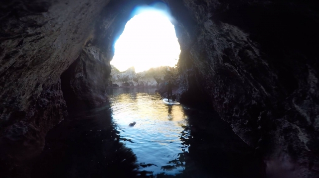  Go under the cliffs of Llanes with the board 