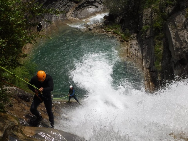  Rappelling next to a waterfall