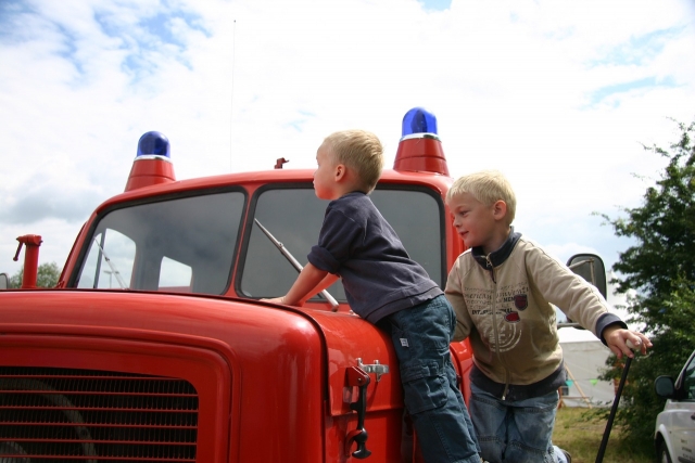 boys in a red car 