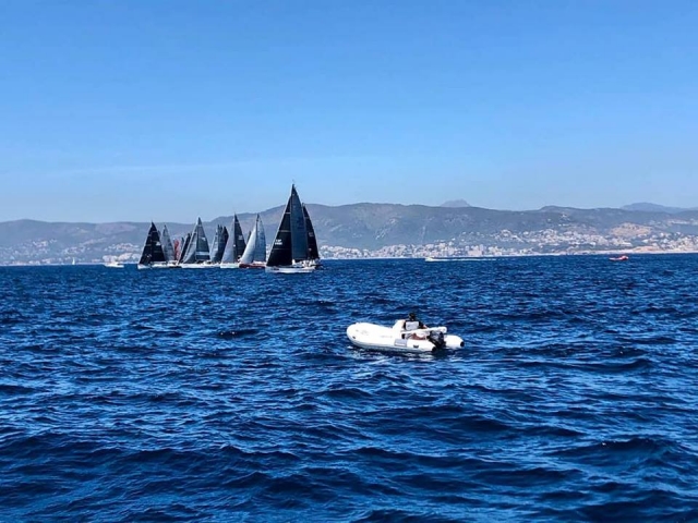  boat with sailboats in the background