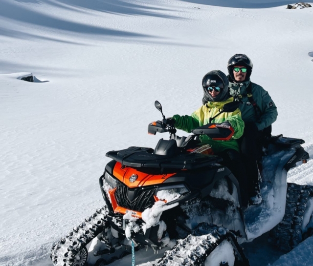  Couple driving the snowmobile